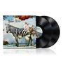 "The Flower Kings" steht in verschnörkelter Schrift. Ein Zebra mit Blumen und Schmetterlingen, davor zwei Schallplatten.