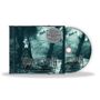 "DUSK... AND HER EMBRACE 30th Anniversary Edition" steht auf einem CD-Case, eine Frau im Wald mit Schloss im Hintergrund.