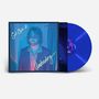Texte: "Get Over it.", "Underdog", "AARON LEE TASJAN". Eine Schallplatte in Blau mit einem Mann in farbigem Licht.