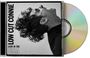 Aufschrift: "LOW CUT CONNIE" und "LIVIN IN THE USA". Schwarz-weißes Profilbild eines Mannes, der nach oben schaut. CD-Hülle.