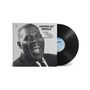 "HOWLIN' WOLF THE REAL FOLK BLUES." Eine Schallplatte mit einem Schwarz-Weiß-Foto eines lachenden Mannes.