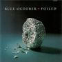 Text: "BLUE OCTOBER FOILED". Eine zerknüllte Alufolie liegt auf einer Oberfläche, spärlich beleuchtet.