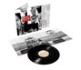 Text: "Simple Minds Once Upon a Time". Zu sehen ist ein Schallplattencover und eine Vinyl-Schallplatte mit Konzertfoto.