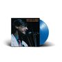 Text: "BRYAN FERRY 'LET'S STICK TOGETHER'". Ein Mann singt in ein Mikrofon. Eine blaue Schallplatte ist sichtbar.