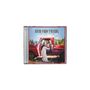 „LITTLE MISS TWAIN, SHANIA TWAIN“. Eine Frau sitzt in einem roten Truck vor einer Waldkulisse. CD-Cover.