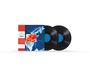 Es sind zwei Schallplatten zu sehen. Links ein blaues und rotes Cover mit der Aufschrift „Abbey Road“.