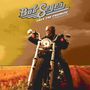„Bob Seger, Face the Promise, Expanded Edition“. Person auf einem Motorrad auf einer Landstraße unter bewölktem Himmel.