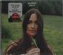 "The New Album from Kacey Musgraves", "Deeper Well". Frau mit langen Haaren hält Blume, grüner Hintergrund.