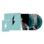 Texte: "HEARTBREAK WEATHER", "NIALL HORAN". Zwei türkis marmorierte Vinyls, ein Cover und ein Foto einer Person.