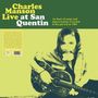 „Charles Manson Live at San Quentin“ in gelber Schrift, Text über Musikaufnahme 1983. Schwarz-weiß Foto eines Mannes mit Gitarre.