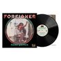 „Foreigner“, „head games“. Ein Vinyl-Cover mit einer Frau in einem Badezimmer, umgeben von Urinalen.