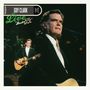 Texte: "GUY CLARK", "Live from Austin TX". Ein Mann mit Gitarre und Mikrofon im Scheinwerferlicht.