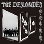 „THE DESLONDES“, „DON'T LET IT DIE“, „VOL. 1“; Menschenrücken auf Bank, stilisierte Tropfen mit Text, Porträtbilder rechts.