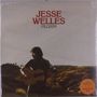Texte: "JESEE WELLES", "PILGRIM", orange Sticker. Silhouette eines Gitarristen vor Landschaft bei Sonnenuntergang.