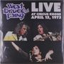 „LIVE AT CIRCUS KRONE APRIL 13, 1973“ und „West Bruce Laing and“. Drei Musiker auf einer Bühne, Fokus auf ihre Gesichtsausdrücke.
