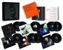 Eine Sammlung von Vinyl-Schallplatten mit Albumcovern. Ein orangener Text "PETER MURPHY LAYING ON NEW WAVES THE 2000s COLLECTION".