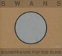 Oben: "SWANS", unten: "SOUNDTRACKS FOR THE BLIND". Mittig: grauer Kreis auf braunem Hintergrund.
