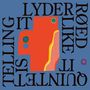 Der Text liest sich: "IT SOUNDS LIKE RED". Ein abstraktes Design mit geometrischen Formen in Rot, Gelb und Grün auf blauem Hintergrund.