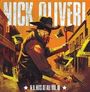 „Nick Oliveri“, „N.O. Hits At All Vol. 10“. Männliche Figur in Cowboykleidung mit Axt und Revolver in einer Westernstadt.