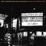 Text oben: "Roky Erickson and the Explosives Live at the Whisky 1981".  
Leuchtreklame: "Whisky a Go Go", "Roky Erickson & The Explosives", "100 Flowers".  
Szene bei Nacht auf einer Straße.