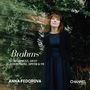"Brahms, Intermezzi, Op.117, Klavierstücke, Opp.118 & 119, Anna Fedorova. Frau in schwarzem Kleid vor grünem Laub. CHANNEL CLASSICS Logo."