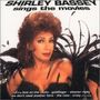 Text: "Shirley Bassey sings the movies". Darunter Lieder: "Love on the Rocks", "Goldfinger". Frau in Federoutfit.