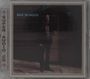 Text: "BOZ SCAGGS", "SUPER AUDIO CD". Dunkles Foto eines Mannes in einem Anzug, teilweise im Schatten.