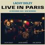 "Lachy Doley Live in Paris, 10 Décembre 2023 - New Morning." Drei Musiker auf einer Bühne, einer spielt Keyboard, einer Schlagzeug, einer Bass.