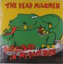 „THE DEAD MILKMEN“ oben. „BIG LIZARD IN MY BACKYARD“ unten. Illustration eines grünen Dinosauriers mit Zigarre.
