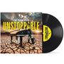 Vinyl mit Cover: Text "THE PIANO GUYS UNSTOPPABLE", ein Piano auf trockener Erde mit dramatischem Himmel.
