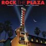 "ROCK THE PLAZA" in Rot. Große Gitarre als Leuchtreklame mit "THEATRE". Nachthimmel mit Palmen und Mondsichel.
