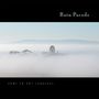 Oben steht "Rain Parade", unten "Home in Any Language". Im Nebel ein Riesenrad und eine Achterbahn.