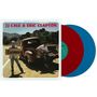 "JJ Cale & Eric Clapton", "Escondido" auf Schild, Mann mit Gitarre auf rotem Truck, zwei Schallplatten, rot und blau.