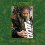 "AUGUSTUS PABLO" und "VALLEY OF JEHOSAPHAT". Ein Mann spielt eine Melodica, umrahmt von grünem Hintergrund mit Blattmustern.