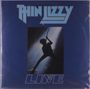 Text: "THIN LIZZY LIVE". Silhouette eines Gitarristen vor hellem Licht auf blauem Hintergrund.
