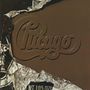 "Chicago" in geschwungener Schrift auf einer Verpackung, umgeben von zerknitterter Aluminiumfolie, mit "WT 10.5 OZ'S."