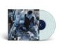 Der Text ist unscharf und schwer zu entziffern. Es zeigt ein farbenfrohes, abstraktes Cover mit Personen und eine durchsichtige Vinyl.
