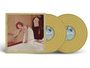 Labels: "DISC 1" und "DISC 2".  
Illustration: Frau im weißen Kleid, lehnt sich auf einen Fernseher, im Hintergrund hängt Kleidung.  
Goldene Schallplatten.