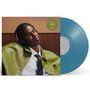 Text auf einem runden Aufkleber: "In My Head ft. Joybon." Person mit Kopfhörern lehnt entspannt zurück, blaue Vinyl-Schallplatte.