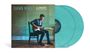 "SHAWN MENDES ILLUMINATE 10TH ANNIVERSARY EDITION" auf einem Bild mit einem Mann, der Gitarre spielt. Zwei türkisfarbene Schallplatten.