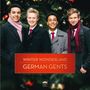 "WINTER WONDERLAND GERMAN GENTS" vor einem weihnachtlich geschmückten Baum; vier lächelnde Männer in Mänteln und Schals.