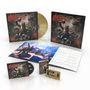 Cover mit "Gods of Thunder" und "Saxon". Enthält LP, CD, Kassette, Notenblatt und Konzertfoto. Illustration mit Krieger.