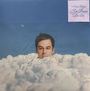 Text: "J'ai Besoin De Toi". Ein Kopf taucht aus Wolken auf, dahinter ein blauer Himmel mit einer kleinen sichtbaren Mondsichel.