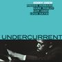 Oben stehen Musikernamen, darunter "UNDERCURRENT". Ein Schwarz-Weiß-Foto zeigt einen Mann am Klavier.