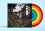 Text: "ARCO" und "IRMAOS YULUIOS." Ein Albumcover zeigt zwei Figuren im Wald, Regenbogen auf Vinylscheibe.