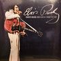 "Elvis Presley, Charlotte Coliseum, North Carolina, February 21st 1977." Elvis mit Mikro und Gitarre auf der Bühne.