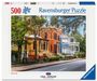 "500 Ravensburger Puzzle, USA Jigsaw Nationals. Bild: Bunte, historische Häuser und Straße mit Bäumen im Vordergrund."
