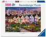Text: "1000 Ravensburger® Puzzle." Illustration von bunten Häusern vor einer Skyline, beleuchtete Straße mit Laternen.