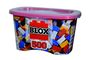 "BLOX 500" steht auf einem Behälter mit bunten Plastikbausteinen und einem rosa Deckel.