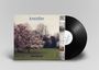 Schriftzug „kreidler“ oben, „weekend“ unten. Plattencover mit blühendem Baum, Vinyl-Schallplatte teilweise sichtbar.